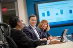 Wesco CEO John Engel (center) with other executives at Pittsburgh headquarters.
